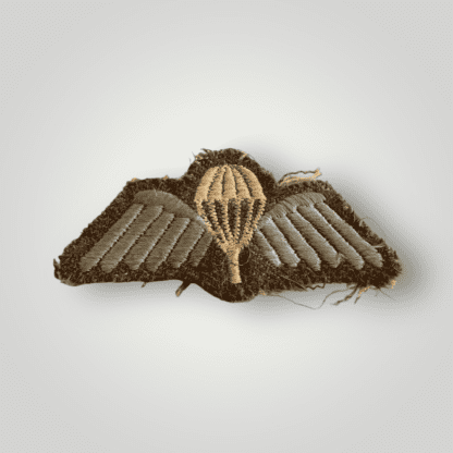 An original British Army WW2 Paratrooper cloth jump wings, embroidered in white and sky blue thread uniform removed.