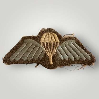 An original British Army WW2 Paratrooper cloth jump wings, embroidered in white and sky blue thread uniform removed.