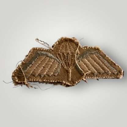 Reverse image of an British Army WW2 Paratrooper cloth jump wings, embroidered in white and sky blue thread uniform removed.