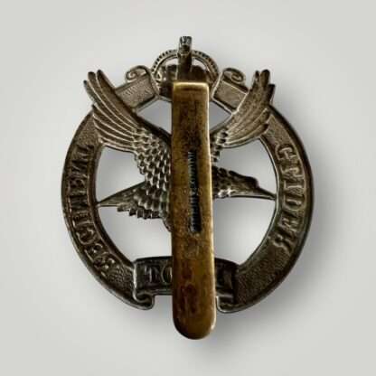 Reverse image of n original WW2 British Glider Pilot Regiment cap badge, die stamped in white metal with makers mark Firmin London.