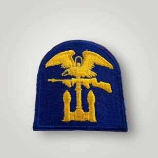 An original US WW2 Army Engineer Special Brigade insignia, machine embroidered in yellow and light blue thread.
