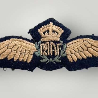 A genuine Royal Australian Air Force WW2 Pilots Wings, embroidered with outstretched wings padded with a central wreath encircling the 'RAAF' monogram with the King's crown above.