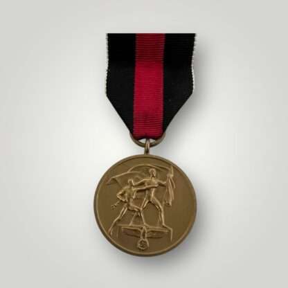 An original Sudetenland medal, die-struck in bronze complete with long original ribbon.