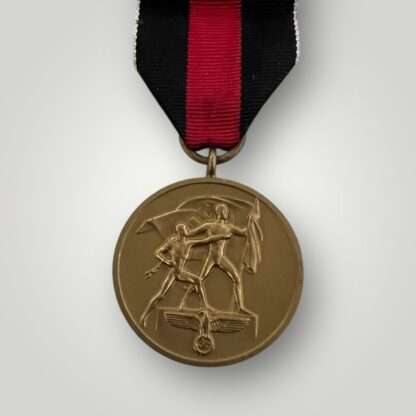 An original Sudetenland medal, die-struck in bronze complete with long original ribbon.