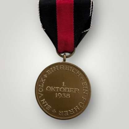 Reverse image of a Sudetenland medal, die-struck in bronze complete with long original ribbon.