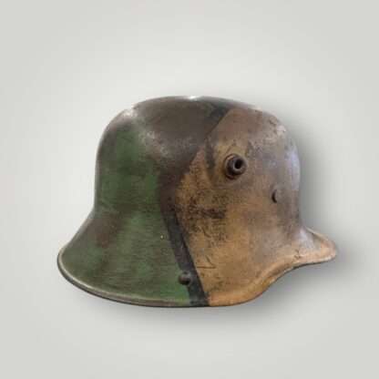 A side view of a German M16 steel camouflage WW1 helmet.