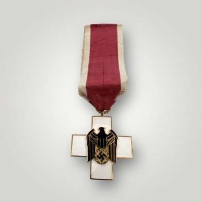 A German WW2 Social Welfare Medal 3rd Class, constructed in gilded bronze with multi-coloured enamel.