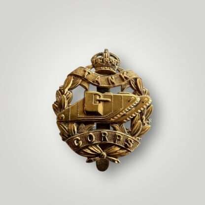 An original British WW1 Royal Tank Corp cap badge, constructed in brass.