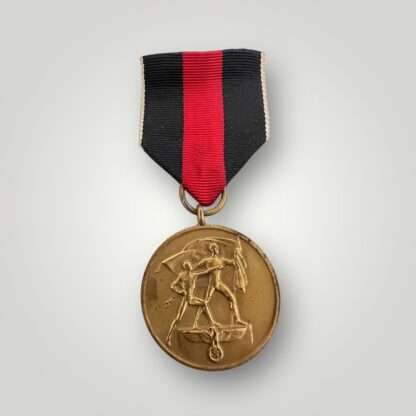 An original Sudetenland medal, die-struck in bronze complete with the original ribbon.