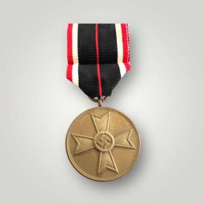 An original War Merit Medal 1939, die struck in bronze with war merit cross in the centre, complete with orginal ribbon.