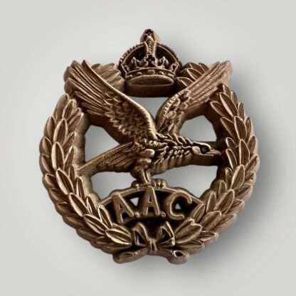 A scarce original British WW2 Army Air Corps plastic cap Badge manufactured in bakelite bronze coloured.