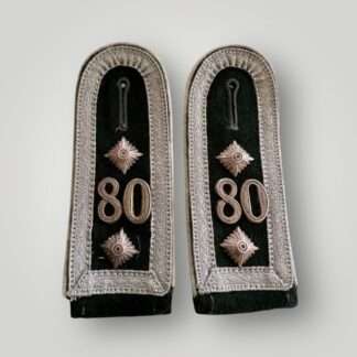 A set of Heer Oberfeldwebel M36 Shoulder Straps 80 Regiment, constructed on dark green wool with aluminum tress border.