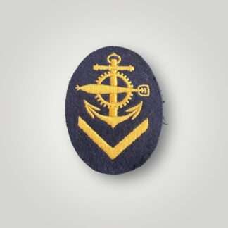 A German WW2 Kriegsmarine EM/NCOs Torpedo Mechanic proficiency badge, machine embroidered in yellow thread on dark blue woollen backing.
