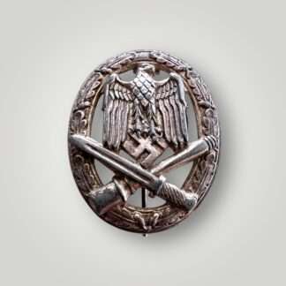 An orginal General Assault Badge By Juncker mid to late war, hollow back construction in cupal silver plated with signs of coming through.