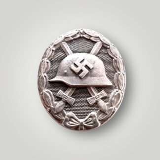 An orginal German WW2 Wound Badge Silver by Foerster & Barth (Verwundetenabzeichen in Silber), constructed in tombak silver with great patina.