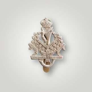 An 8th (Irish) Battalion the King's Liverpool Regiment Cap Badge, constructed in white metal.