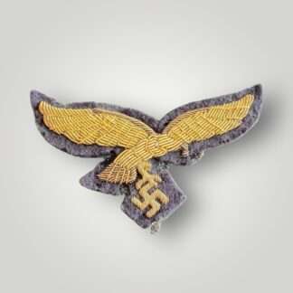 A rare Luftwaffe General's Summer Breast Eagle, hand-embroidered in gold bullion on blue backing.