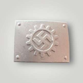 An original German Labour Front belt buckle by Overhoft. Constructed in aluminium die struck with a silver wash. The rectangular buckle features a centrally placed DAF Deutsche Arbeitsfront (German Labour Front) emblem, which consists of a canted swastika surrounded by a cog wheel, with four domes in each corner.