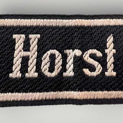 A close up image of a 18th SS Volunteer Panzergrenadier Division Horst Wessel cufftitle.