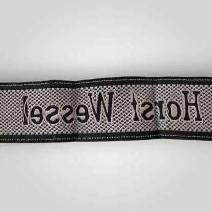 Reverse image of a 18th SS Volunteer Panzergrenadier Division Horst Wessel cufftitle.