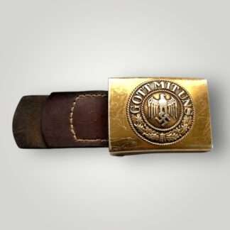An early German WW2 Kriegsmarine EM/NCOs Belt Buckle By Richard Sieper & Söhne. One piece construction die struck gilded adonised alluminiumum with nice gilt finish and leather tab dates 1938.