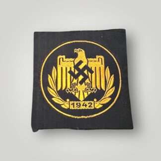 A German WW2 NSRL Bronze Sports Vest Badge, machine embroidered BeVo construction in gold thread on black rayon.