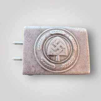An original RAD Belt & Buckle by Gustav Brehmer. Constructed in aluminium die struck. The obverse of the buckle bears a central raised Reichsarbeitsdienst (Reich Labour Service/RAD) insignia, situated within a circular wheat stalk wreath.