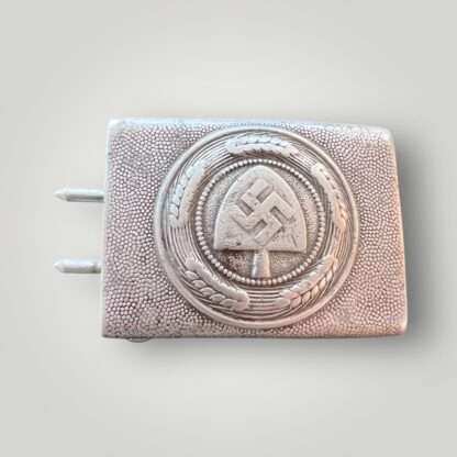 An original RAD Belt & Buckle by Gustav Brehmer. Constructed in aluminium die struck. The obverse of the buckle bears a central raised Reichsarbeitsdienst (Reich Labour Service/RAD) insignia, situated within a circular wheat stalk wreath.