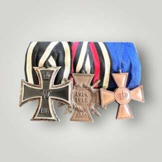 An original Imperial German trio medal set court mounted which includes Iron Cross 2nd Class, Prussian XV Year Service Medal and a Hindenburg 1914 - 1918 cross with original ribbons.