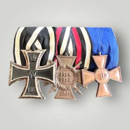 An original Imperial German trio medal set court mounted which includes Iron Cross 2nd Class, Prussian XV Year Service Medal and a Hindenburg 1914 - 1918 cross with original ribbons.