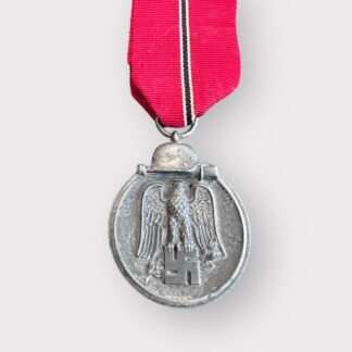 An original Sudetenland medal to commemorate the 1st October 1938, die-struck in bronze measuring 32mm with presentation box.