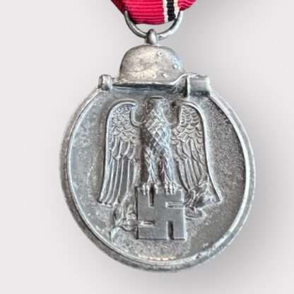 An original Sudetenland medal to commemorate the 1st October 1938, die-struck in bronze measuring 32mm with presentation box.