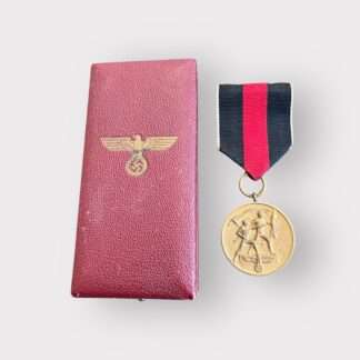 An original Sudetenland medal to commemorate the 1st October 1938, die-struck in bronze measuring 32mm with presentation box. The presentation case is covered in burgundy leatherette embossed on the lid with a Wehrmacht Eagle in gold.