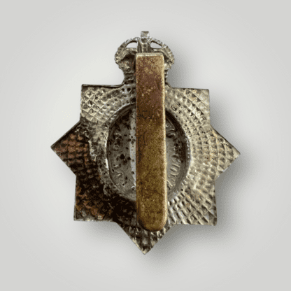 Rverse image of a an original 1st King's Dragoon Guards (1st Pattern) circa 1915 -1937, the badge is constructed in white metal and brass.