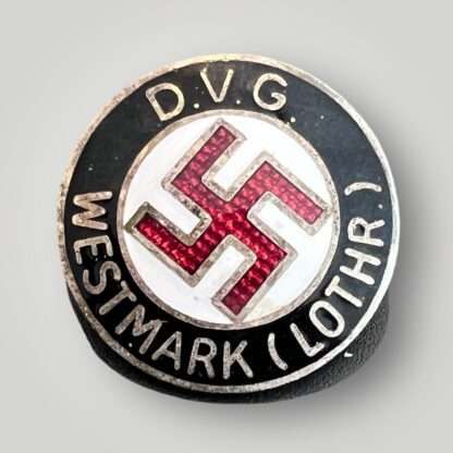 A DVG Westmark (Lothr.) By W.Redo Party Pin (Deutscher Volksgenossen Bund Mitgliedsabzeichen). Constructed in black, red, and white enamel.