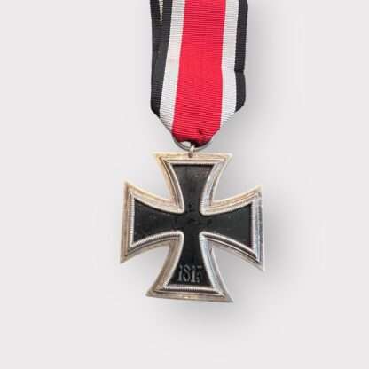 Reverse image of an original Iron Cross 1939 2nd Class Medal unmarked, constructed with silver frame and magnetic iron core with original ribbon dated 1813.