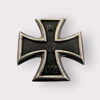 A rare German Imperial WW1 Iron Cross 1st Class 1914 minature Version, three part contruction with magnetic iron core. The obverse retains its original black matt paint finish, and imperial crown and W is crisp with beautiful patina.