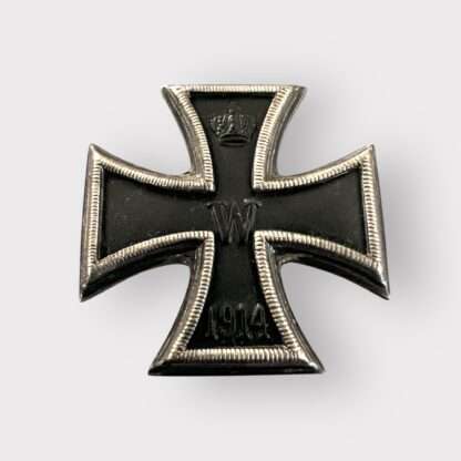 A rare German Imperial WW1 Iron Cross 1st Class 1914 minature Version, three part contruction with magnetic iron core. The obverse retains its original black matt paint finish, and imperial crown and W is crisp with beautiful patina.