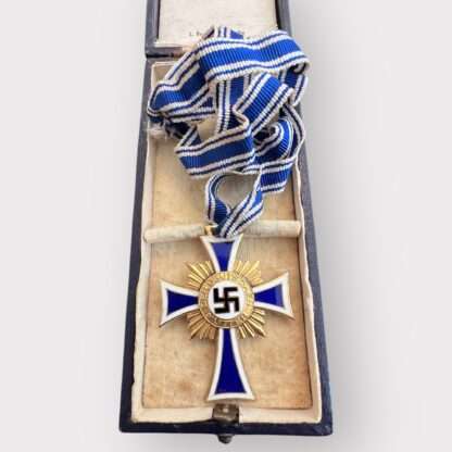 An orginal German Mother's Cross Gold by Ludwig Bertsch with presentation case, two-piece construction bronze gilt and enamel complete with full-length neck ribbon. 
