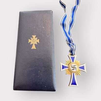 An orginal German Mother's Cross Gold by Ludwig Bertsch with presentation case, two-piece construction bronze gilt and enamel complete with full-length neck ribbon. 