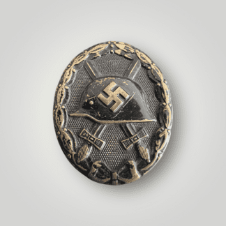 A WW2 German Wound Badge Black, die struck in tombac with hollow back construction.