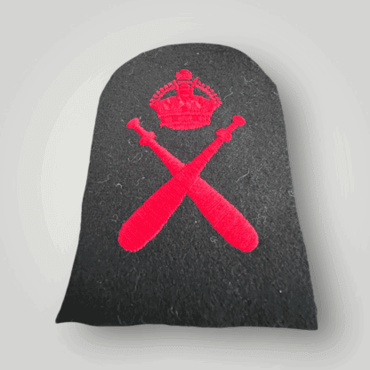A Bristish Royal Navy WW2 Physical Training Instructors Trade Badge, machine embroidered in red thread on dark blue wool backing