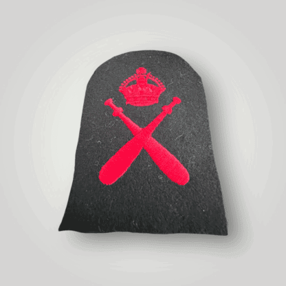 A Bristish Royal Navy WW2 Physical Training Instructors Trade Badge, machine embroidered in red thread on dark blue wool backing