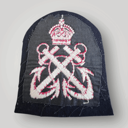 Reverse image of an orginal British WW2 Petty Officers Rank Cloth Badge, machine embroidered in red tread on dark blue wool.