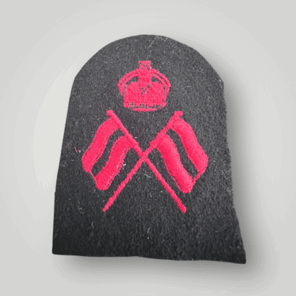 An orginal British Royal Navy Visual Signalman 2nd Class Trade Badge, machine embroidered in red thread on dark blue wool