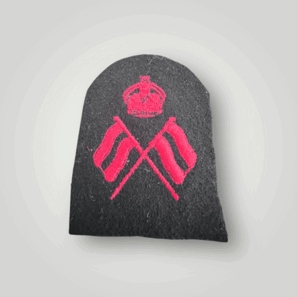 An orginal British Royal Navy Visual Signalman 2nd Class Trade Badge, machine embroidered in red thread on dark blue wool