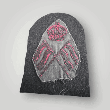 Reverse image of an orginal British Royal Navy Visual Signalman 2nd Class Trade Badge, machine embroidered in red thread on dark blue wool