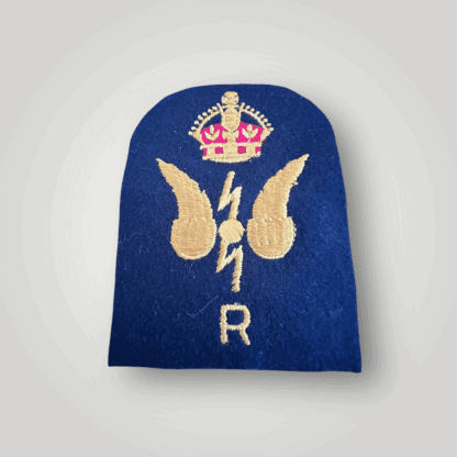 An original British Royal Navy WW2 Wireless Telegraphist & Radar Trade Badge, machine embroidered with yellow and red thread on dark blue wool.