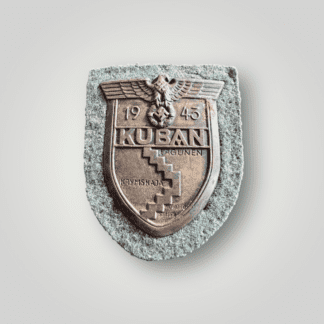 A Heer Kuban Campaign Shield made of bronzed steel features a map of the Kuban region with "KUBA," a Wehrmacht eagle, a wreathed mobile swastika, and the date "1943." It is attached with four prongs to a magnetic backplate, field-grey wool liner.