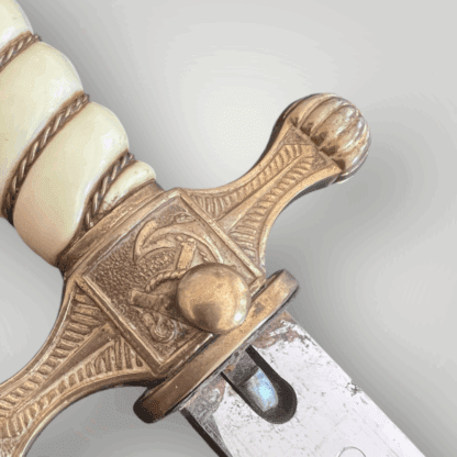 A German WW2 Kriegsmarine officers dagger cross guard and grip by Carl Eickhorn.